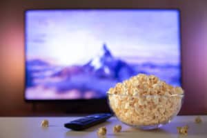 Movie screen and clear bowl of popcorn